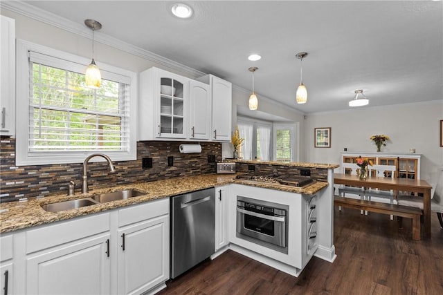 449 Bateman Rd, North Fayette, PA 15071 - kitchen featuring stainless steel appliances, a sink, ornamental molding, backsplash, and a peninsula