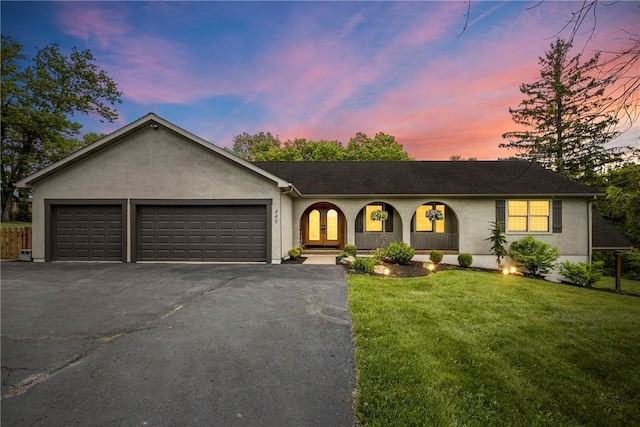 449 Bateman Rd, North Fayette, PA 15071 - single story home with stucco siding, driveway, a garage, and a front yard