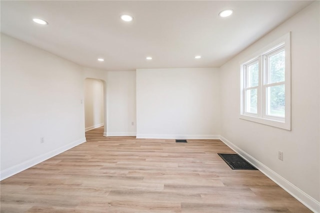 3510 Middletown Rd, Crafton Heights, PA 15204 - unfurnished room with arched walkways, recessed lighting, baseboards, and light wood-style floors