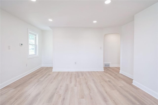 3510 Middletown Rd, Crafton Heights, PA 15204 - empty room featuring light wood-style floors, recessed lighting, baseboards, and arched walkways