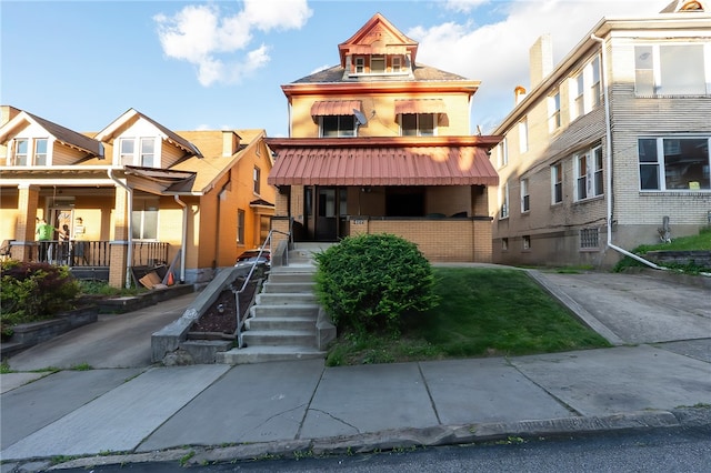 422 Hays Ave, Mount Oliver, PA 15210 - view of front facade featuring a porch and brick siding