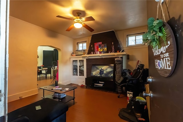 422 Hays Ave, Mount Oliver, PA 15210 - living area with arched walkways, a ceiling fan, wood finished floors, and baseboards