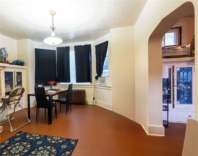 422 Hays Ave, Mount Oliver, PA 15210 - dining room featuring arched walkways, radiator, cooling unit, and wood finished floors