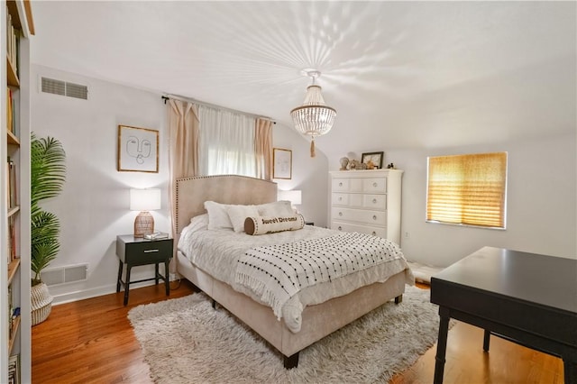 2351 Saranac Ave, Beechview, PA 15216 - bedroom featuring multiple windows, wood finished floors, a chandelier, and baseboards