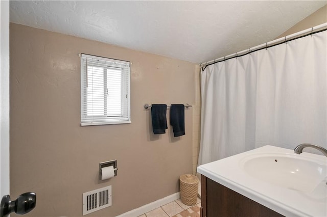 2351 Saranac Ave, Beechview, PA 15216 - full bath with a sink, tile patterned flooring, baseboards, and curtained shower