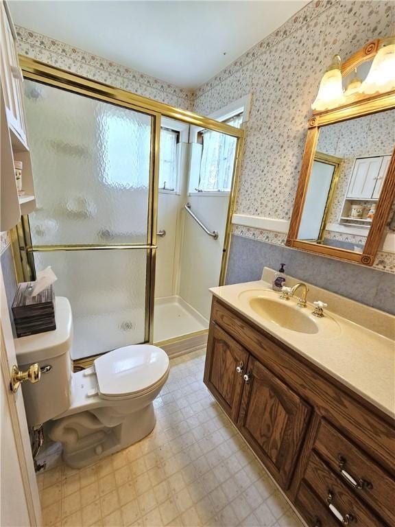 235 Mcclay Rd, Canton Twp, PA 15301 - full bathroom with wallpapered walls, toilet, a stall shower, vanity, and tile patterned floors