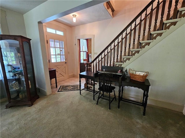 235 Mcclay Rd, Canton Twp, PA 15301 - carpeted foyer entrance featuring stairs and baseboards