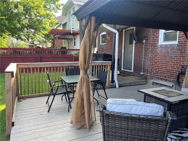 deck featuring outdoor dining area