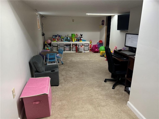 game room with carpet flooring and an office area