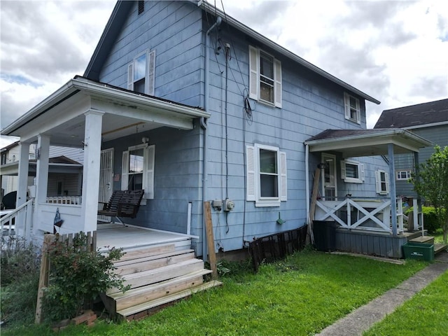 328 3rd St, City Of But Ne, PA 16001 - back of property featuring covered porch and a yard