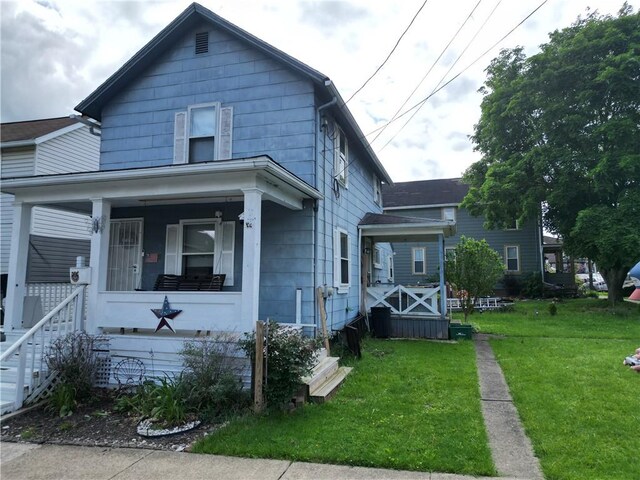 328 3rd St, City Of But Ne, PA 16001 - american foursquare style home with covered porch and a front yard