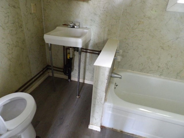 141 Pierce Ave, Sharpsville, PA 16150 - bathroom with wood finished floors, a bath, and toilet