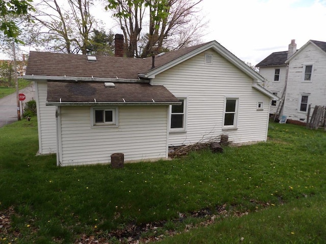 141 Pierce Ave, Sharpsville, PA 16150 - back of property with a yard, a chimney, and a shingled roof