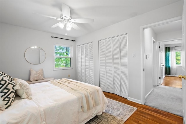 109 Meadowvue Dr, Marshall, PA 15090 - bedroom with multiple windows, multiple closets, wood finished floors, and baseboards