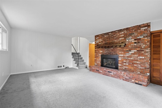 109 Meadowvue Dr, Marshall, PA 15090 - unfurnished living room featuring a fireplace, carpet flooring, baseboards, and stairway
