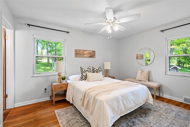 109 Meadowvue Dr, Marshall, PA 15090 - bedroom featuring multiple windows, wood finished floors, baseboards, and a ceiling fan