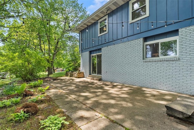 109 Meadowvue Dr, Marshall, PA 15090 - view of property exterior featuring brick siding, board and batten siding, and a patio