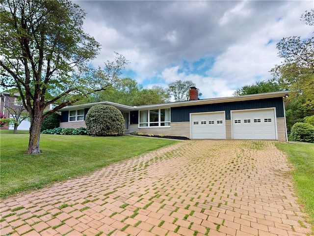 306 Cherokee Dr, Center Twp But, PA 16001 - ranch-style house featuring decorative driveway, a chimney, a garage, a front lawn, and brick siding