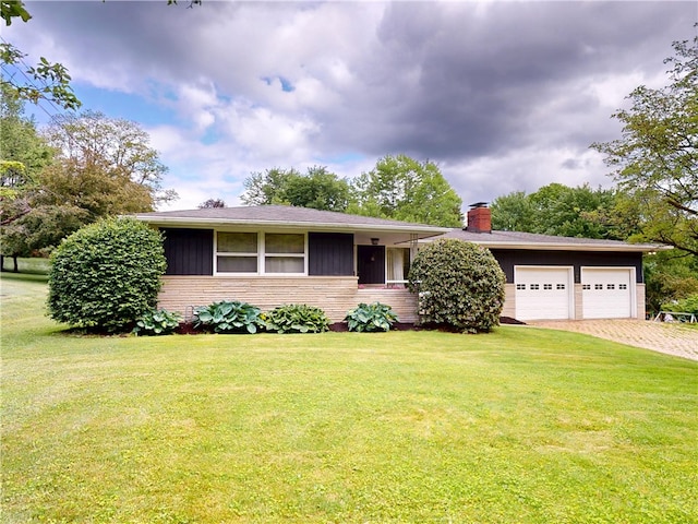 306 Cherokee Dr, Center Twp But, PA 16001 - ranch-style home with a chimney, an attached garage, a front yard, and driveway