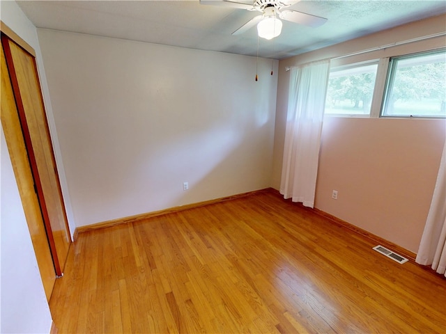 306 Cherokee Dr, Center Twp But, PA 16001 - unfurnished bedroom with light wood-style flooring, baseboards, ceiling fan, and a closet