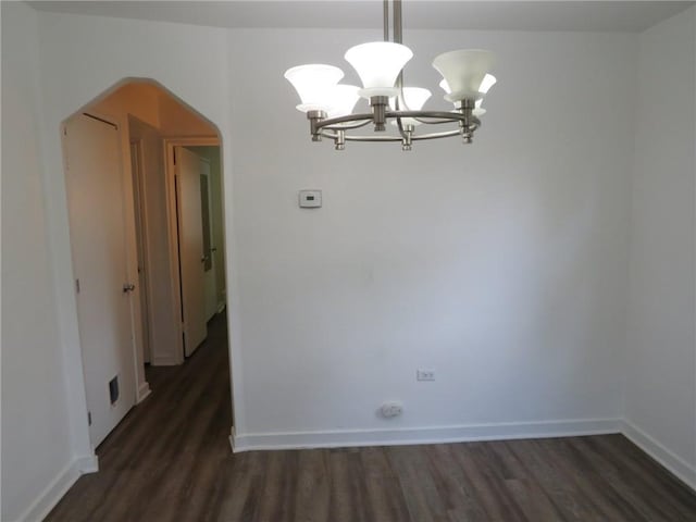985 Mcneilly Rd, Mt Lebanon, PA 15226 - empty room with arched walkways, a chandelier, wood finished floors, and baseboards