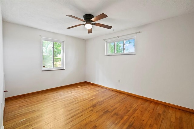 119 Hillcrest Dr, Ross Twp, PA 15237 - unfurnished room featuring healthy amount of natural light, light wood-style floors, and baseboards
