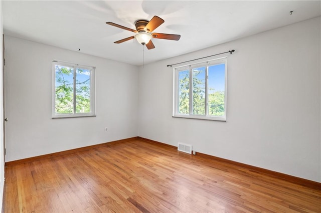 119 Hillcrest Dr, Ross Twp, PA 15237 - unfurnished room with healthy amount of natural light, light wood-type flooring, ceiling fan, and baseboards