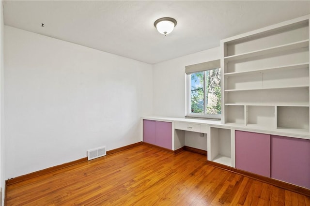 119 Hillcrest Dr, Ross Twp, PA 15237 - unfurnished office featuring light wood-style flooring, built in study area, and baseboards