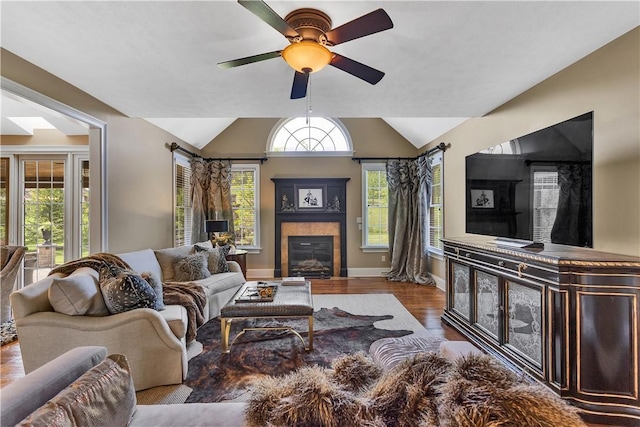 117 Majestic Dr, Adams Twp, PA 16046 - living room featuring wood finished floors, a tile fireplace, lofted ceiling, ceiling fan, and baseboards