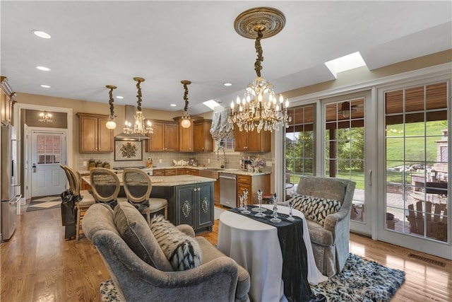 117 Majestic Dr, Adams Twp, PA 16046 - living area featuring a chandelier, recessed lighting, light wood-style floors, and a skylight