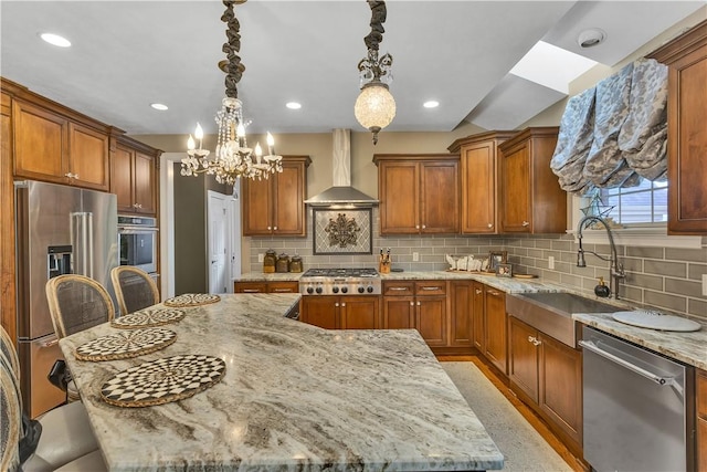 117 Majestic Dr, Adams Twp, PA 16046 - kitchen with wall chimney range hood, stainless steel appliances, light stone countertops, a sink, and a chandelier