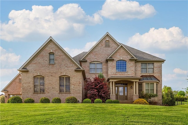 117 Majestic Dr, Adams Twp, PA 16046 - view of front facade with brick siding, a front lawn, and a shingled roof