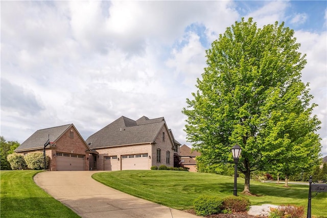 117 Majestic Dr, Adams Twp, PA 16046 - view of front of property with brick siding, concrete driveway, an attached garage, a front lawn, and a shingled roof
