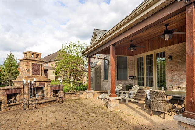 117 Majestic Dr, Adams Twp, PA 16046 - view of patio / terrace featuring an outdoor stone fireplace, ceiling fan, and outdoor dining space