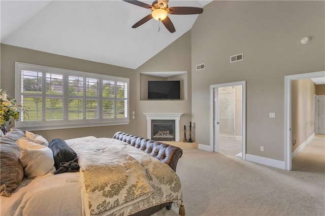 117 Majestic Dr, Adams Twp, PA 16046 - carpeted bedroom with high vaulted ceiling, baseboards, a glass covered fireplace, a ceiling fan, and ensuite bath