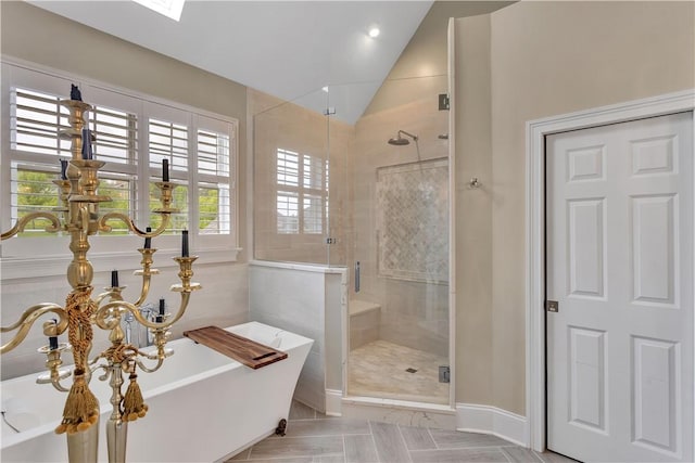 117 Majestic Dr, Adams Twp, PA 16046 - bathroom featuring a shower stall, lofted ceiling, a freestanding tub, and baseboards