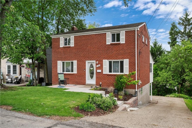 156 Carnation Ave, Ross Twp, PA 15229 - colonial-style house with a chimney, brick siding, and a front yard