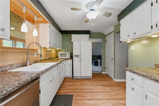 156 Carnation Ave, Ross Twp, PA 15229 - kitchen featuring white appliances, a sink, ceiling fan, light wood-style flooring, and white cabinetry