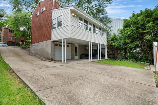 156 Carnation Ave, Ross Twp, PA 15229 - view of front of house featuring an attached garage, driveway, and a carport