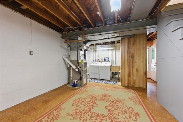 156 Carnation Ave, Ross Twp, PA 15229 - below grade area featuring washer and clothes dryer, plenty of natural light, and concrete block wall
