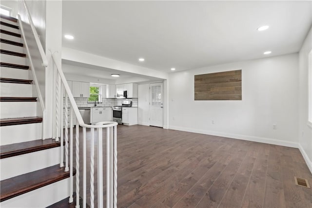 2101 Forge Dr, Hopewell Twp Bea, PA 15001 - unfurnished living room with dark wood-style flooring, recessed lighting, stairs, and baseboards
