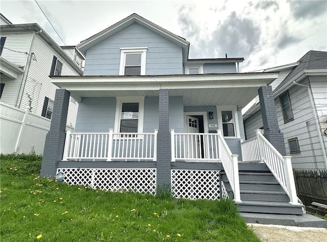 94 Lenox St, Uniontown, PA 15401 - view of front of house featuring a porch and a front yard