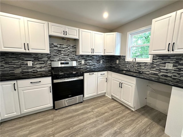 94 Lenox St, Uniontown, PA 15401 - kitchen featuring gas stove, a sink, light wood-style floors, dark countertops, and recessed lighting
