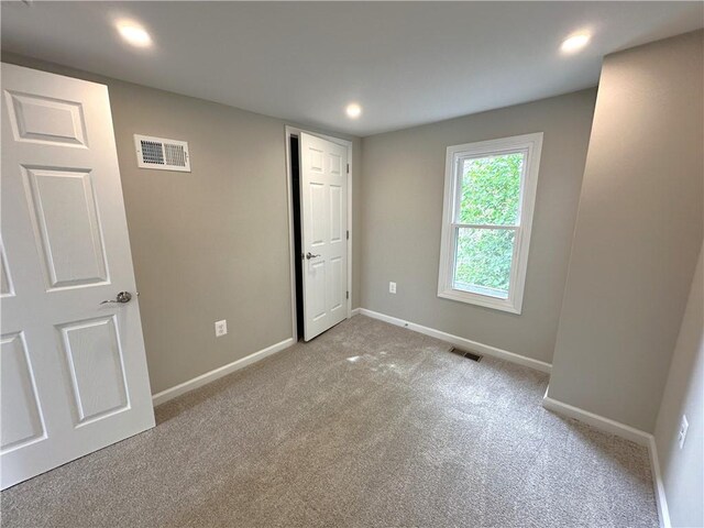 94 Lenox St, Uniontown, PA 15401 - unfurnished bedroom featuring baseboards, light colored carpet, and recessed lighting