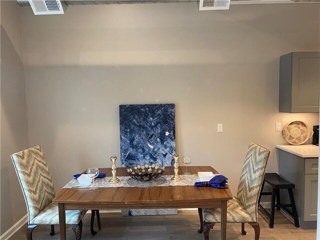 3809 Liberty Ave Unit 206, Lawrenceville, PA 15201 - dining area with light wood finished floors and baseboards
