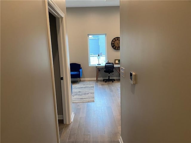 3809 Liberty Ave Unit 206, Lawrenceville, PA 15201 - hallway with wood finished floors, baseboards, and a desk