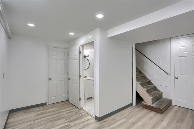 622 Ascension Dr, West Mifflin, PA 15122 - finished below grade area with light wood-style flooring, baseboards, recessed lighting, stairs, and concrete block wall