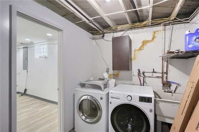 622 Ascension Dr, West Mifflin, PA 15122 - laundry area with washing machine and dryer, electric panel, and light wood finished floors