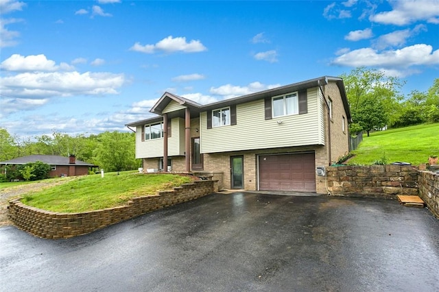 512 Leckrone Highhouse Rd, Pa, PA 15458 - raised ranch with driveway, brick siding, a garage, and a front yard