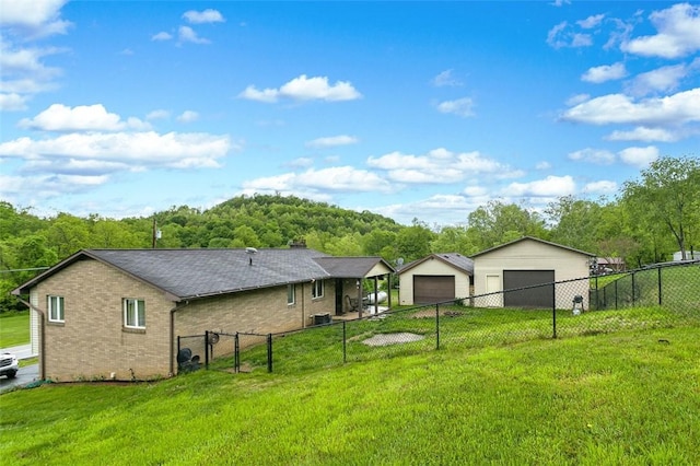 512 Leckrone Highhouse Rd, Pa, PA 15458 - back of property with a garage and brick siding